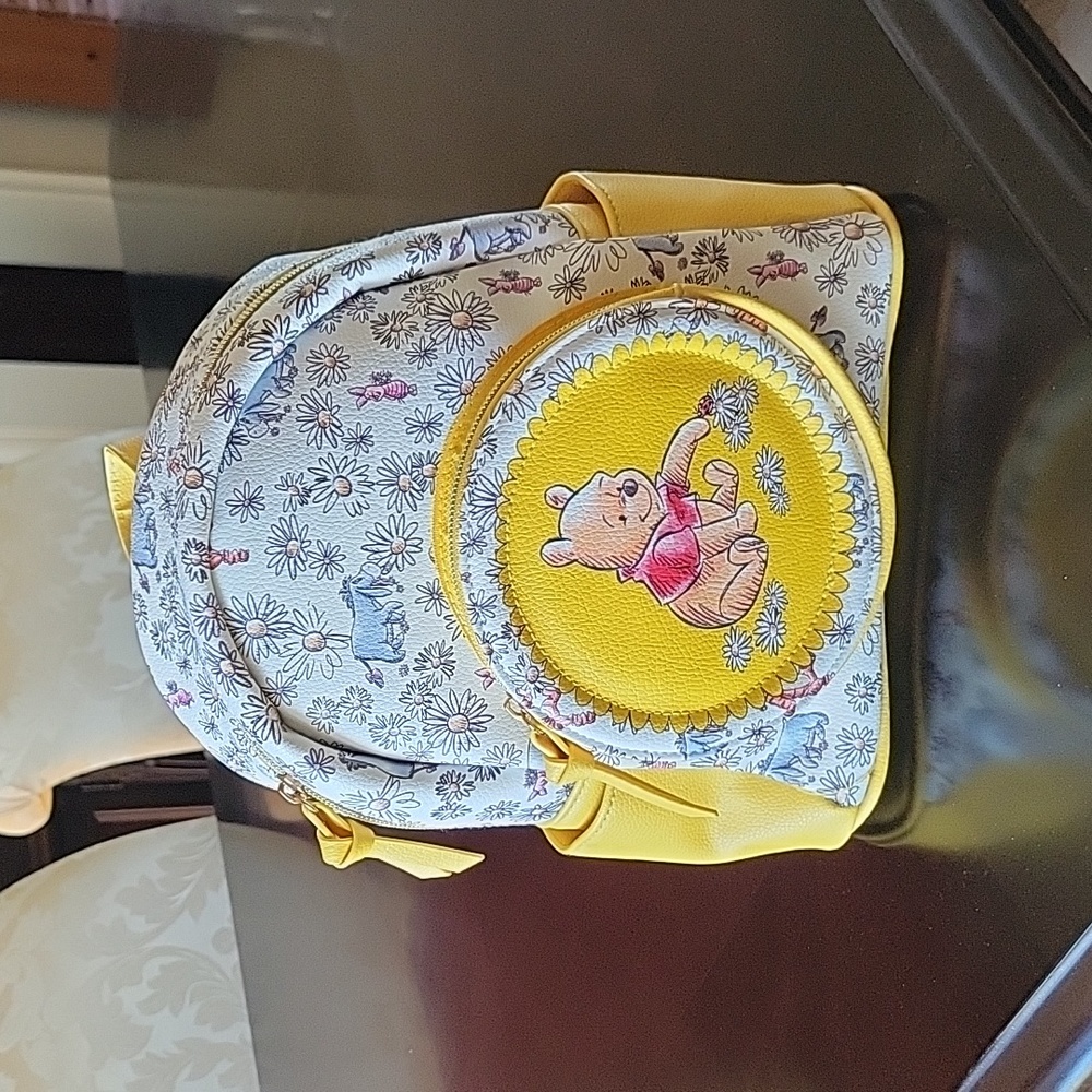 DANI by Danielle Nicole Pooh Daisies mini backpack